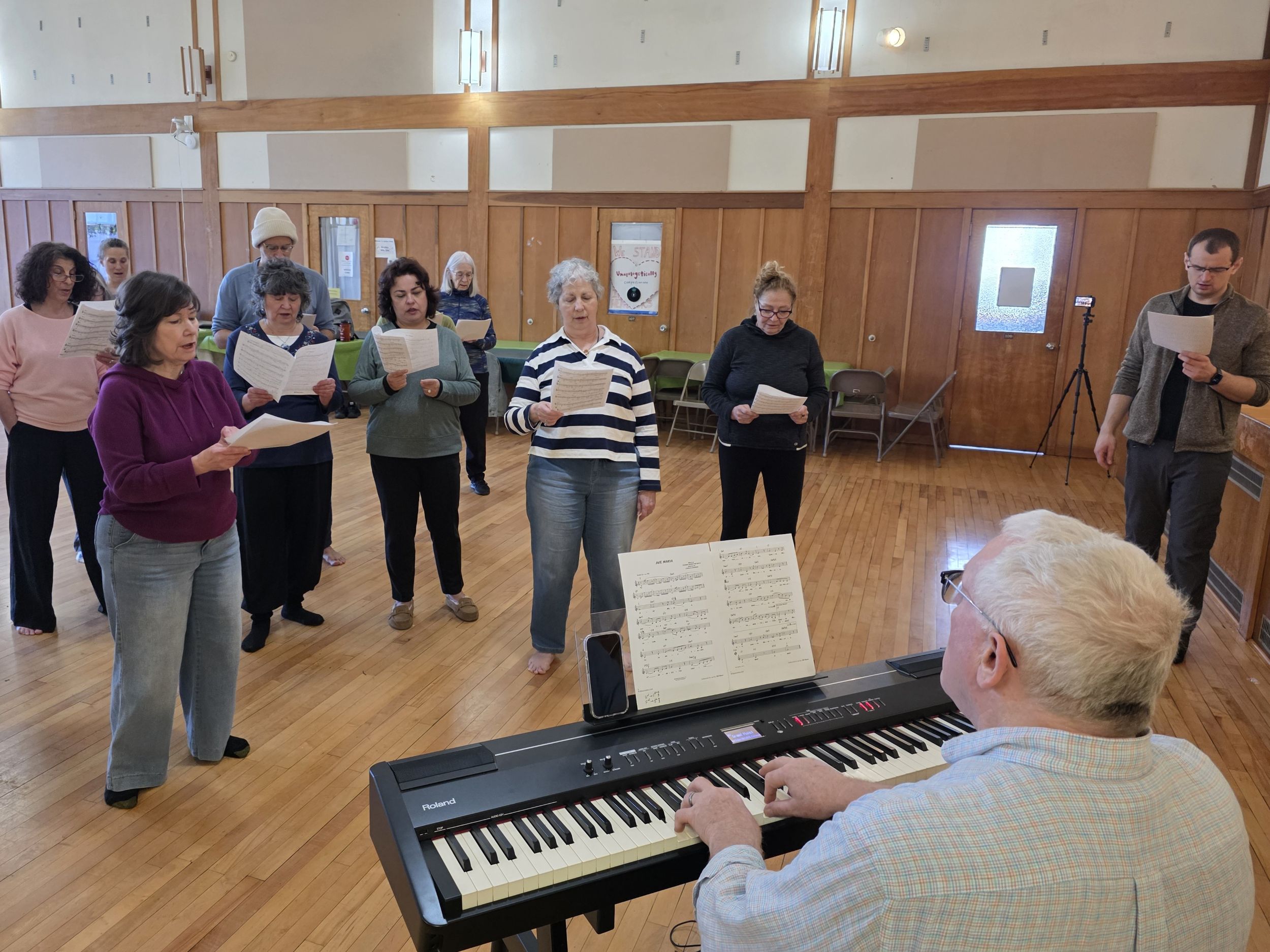 Presenter William Bauer (in foreground, playing keyboard) leads participants in Move to the Music! An Exploration of Choral Singing via Rhythm and Movement, at the Reformed Church of Highland Park, March 21, 2026.